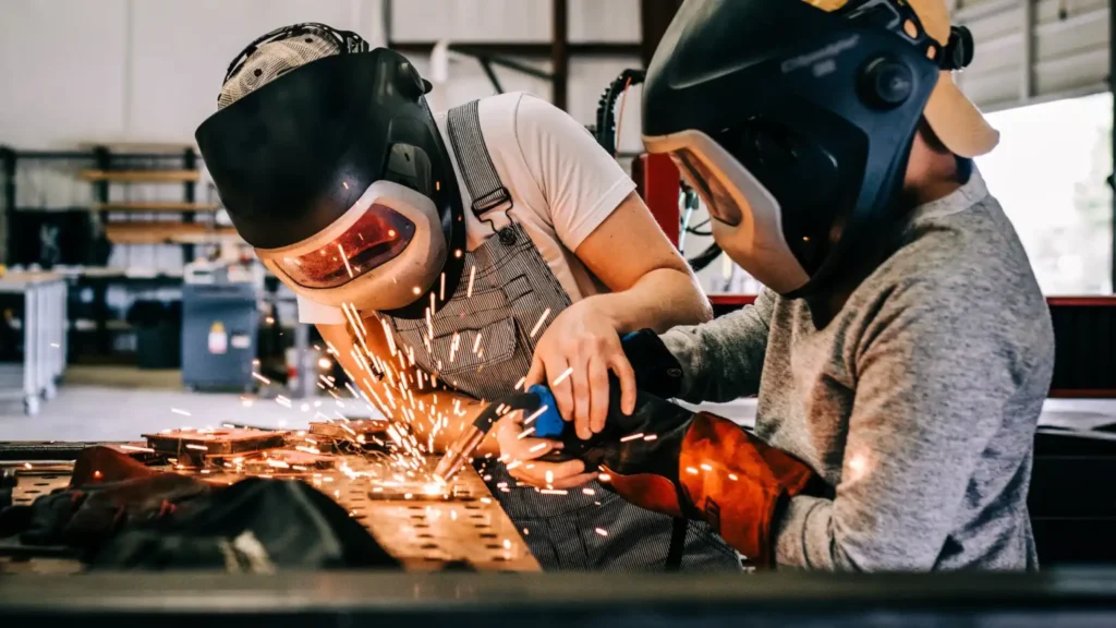 a female welder teaches a ondustry 1536x864